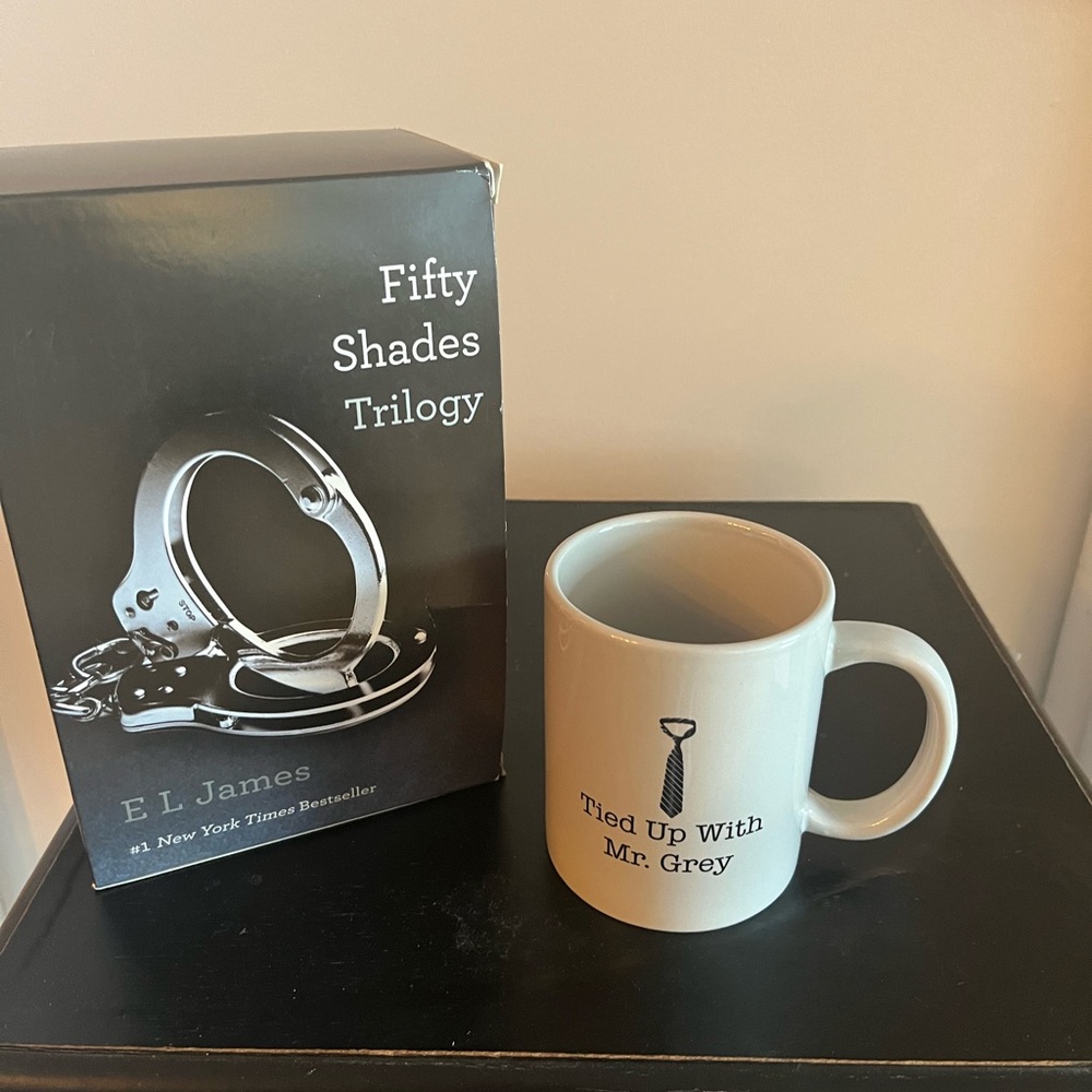 Fifty Shades of Grey trilogy and NWT coffee mug. Great gift .